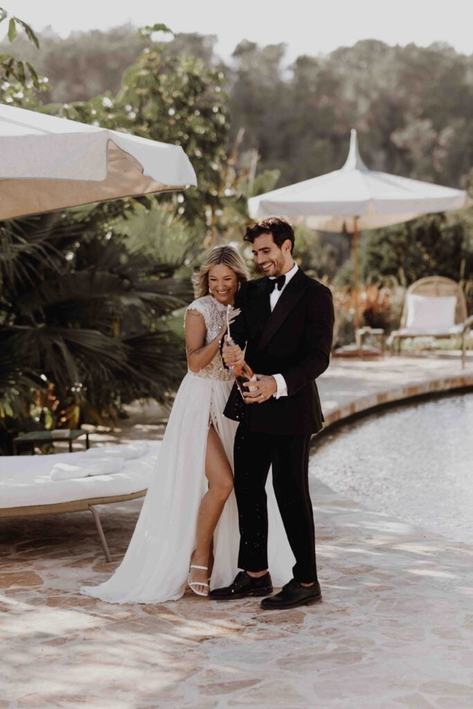 Ibiza-wedding-at-finca-delica-couple-holding-champagne